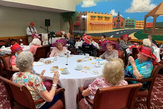 Red hats dinner party at Dominican Village