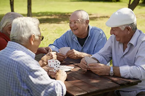 Independent seniors playing cards at The Villas Dominican Village